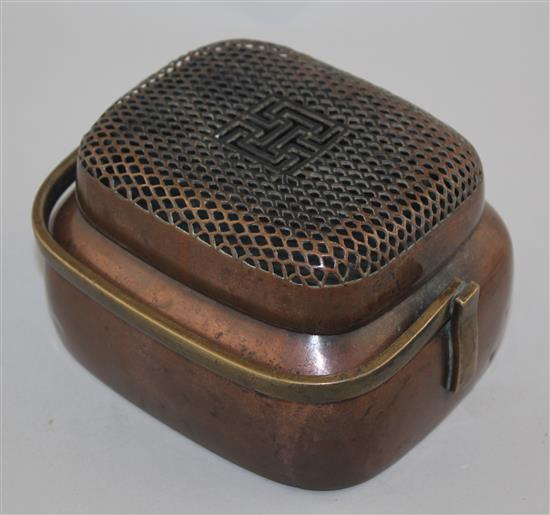 A Chinese copper bronze oblong hand warmer, 18th / 19th century, 15cm